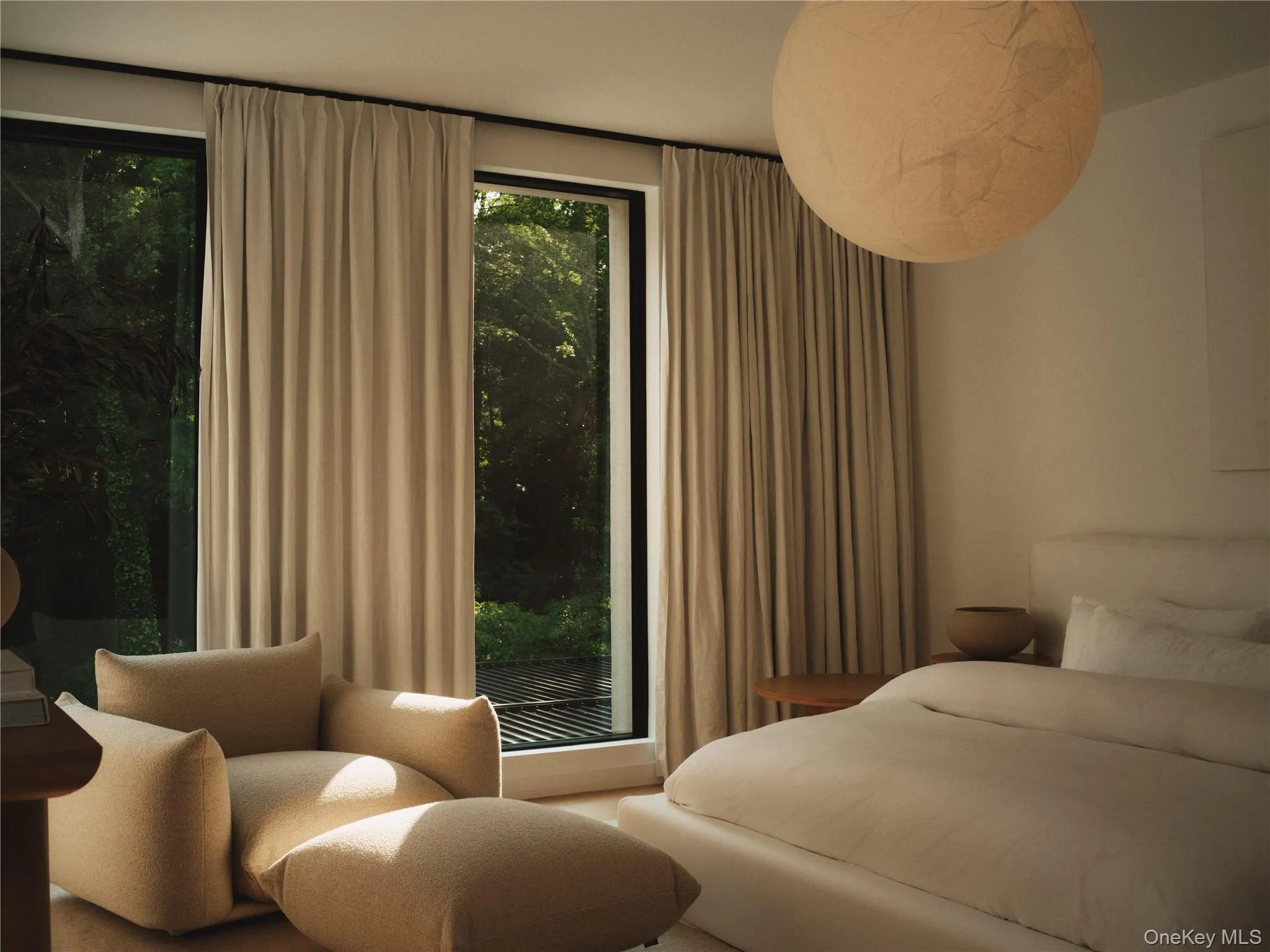 Guest ensuite bedroom w/ floor to ceiling windows and Luxury European Light Fixture Guest ensuite bedroom w/ floor to ceiling windows and Luxury European Light Fixture