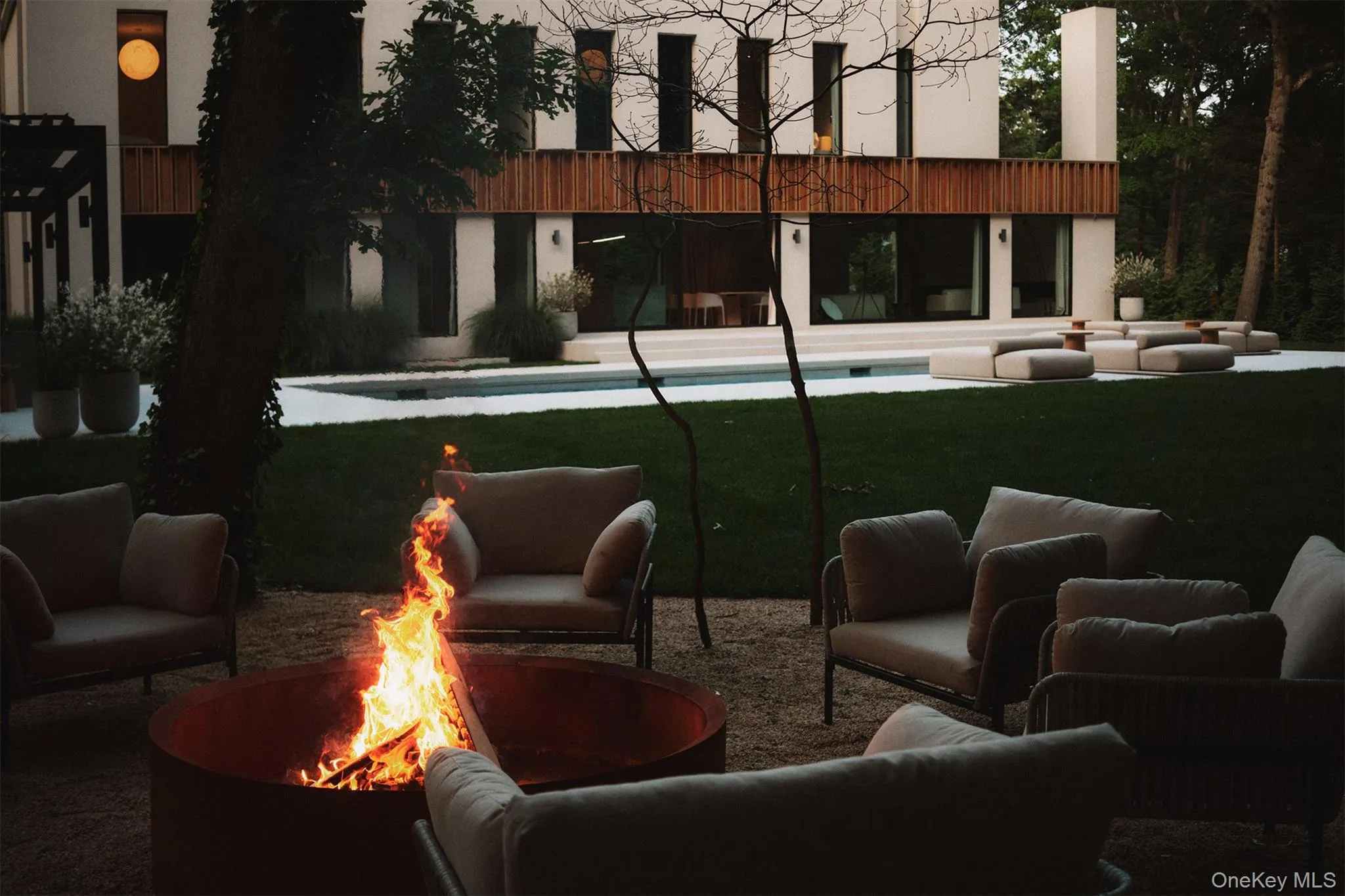 Firepit area overlooking back of the property. Firepit area overlooking back of the property.