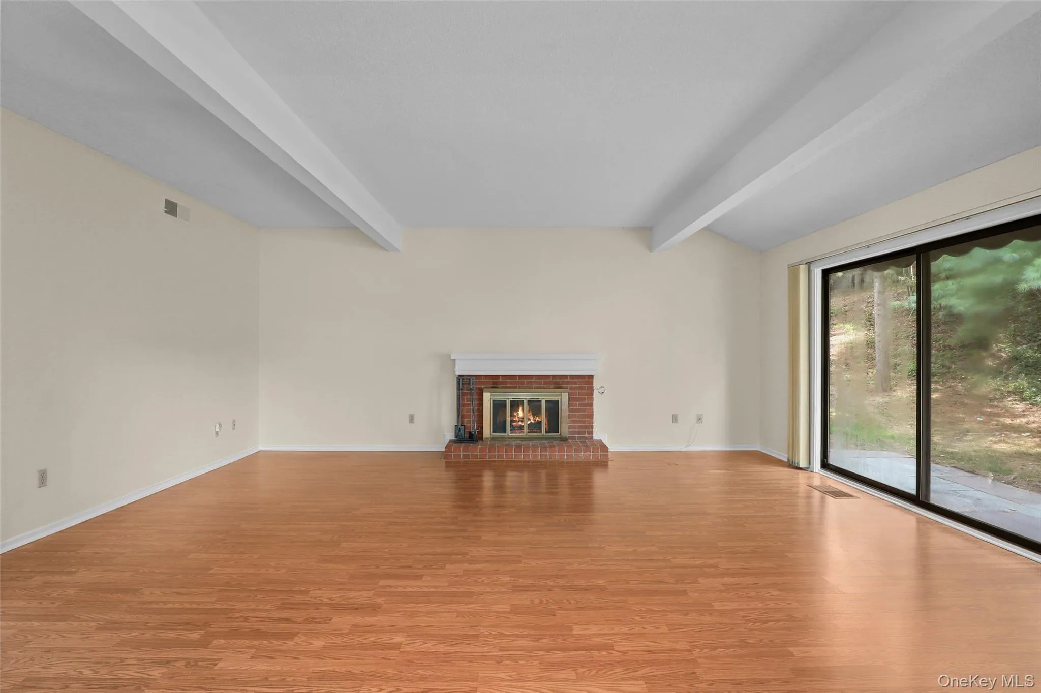 Living room with brick fireplace Living room with brick fireplace