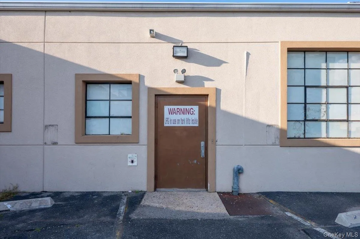 Entrance to property with stucco siding Entrance to property with stucco siding