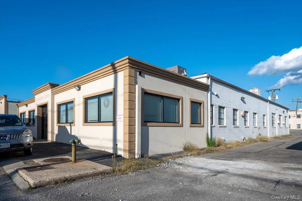 View of property exterior featuring stucco siding View of property exterior featuring stucco siding