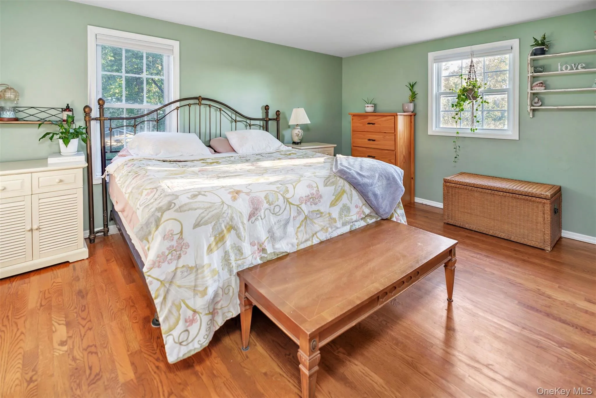 Primary Bedroom featuring wood finished floors Primary Bedroom featuring wood finished floors