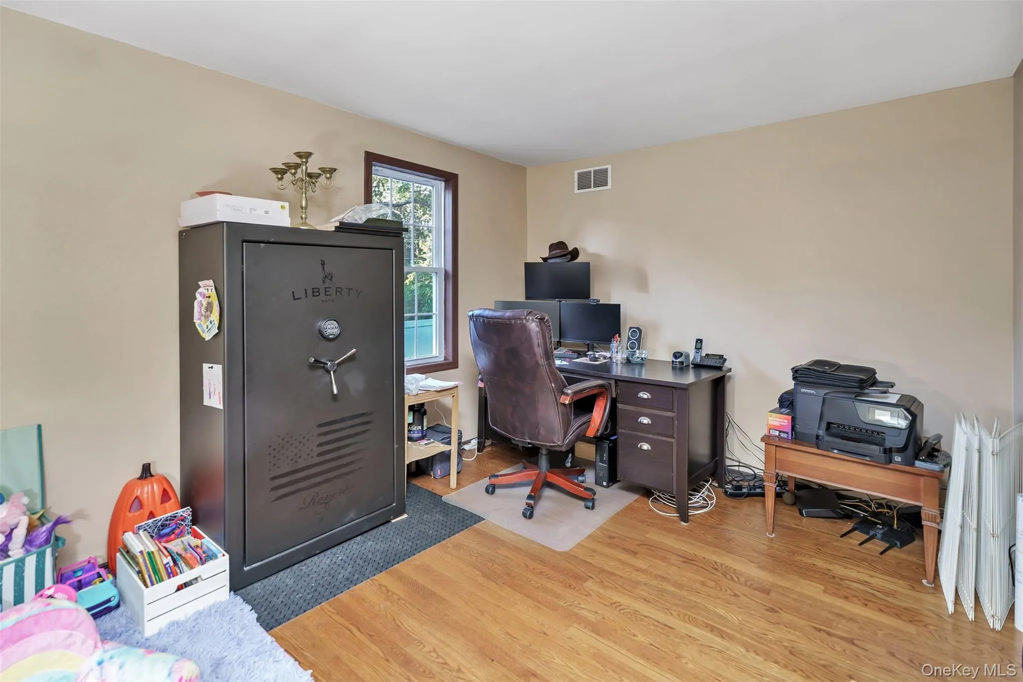 1st Floor Bedroom/Office area featuring light wood finished floors 1st Floor Bedroom/Office area featuring light wood finished floors