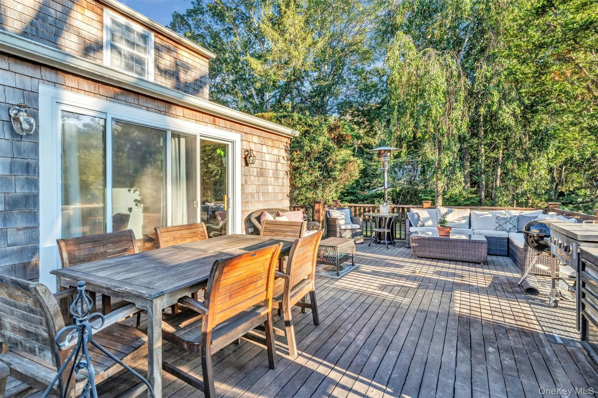 Deck featuring an outdoor hangout area and outdoor dining area Deck featuring an outdoor hangout area and outdoor dining area