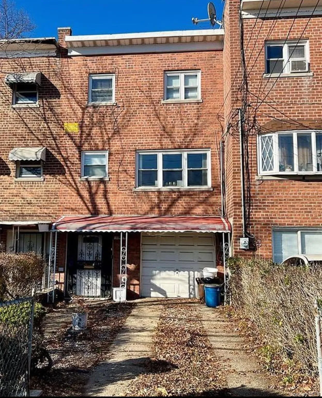 View of front of property featuring brick siding, driveway, and an attached garage View of front of property featuring brick siding, driveway, and an attached garage