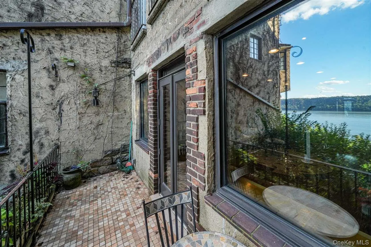 View of patio / terrace with a water view and french doors View of patio / terrace with a water view and french doors