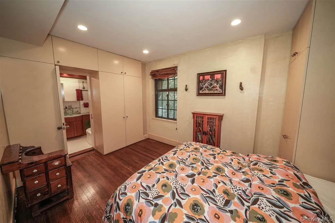Bedroom featuring a closet, dark wood finished floors, and recessed lighting Bedroom featuring a closet, dark wood finished floors, and recessed lighting