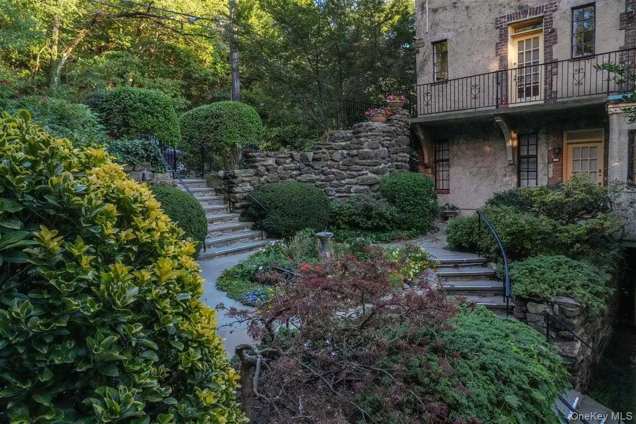 View of yard with stairs and a balcony View of yard with stairs and a balcony