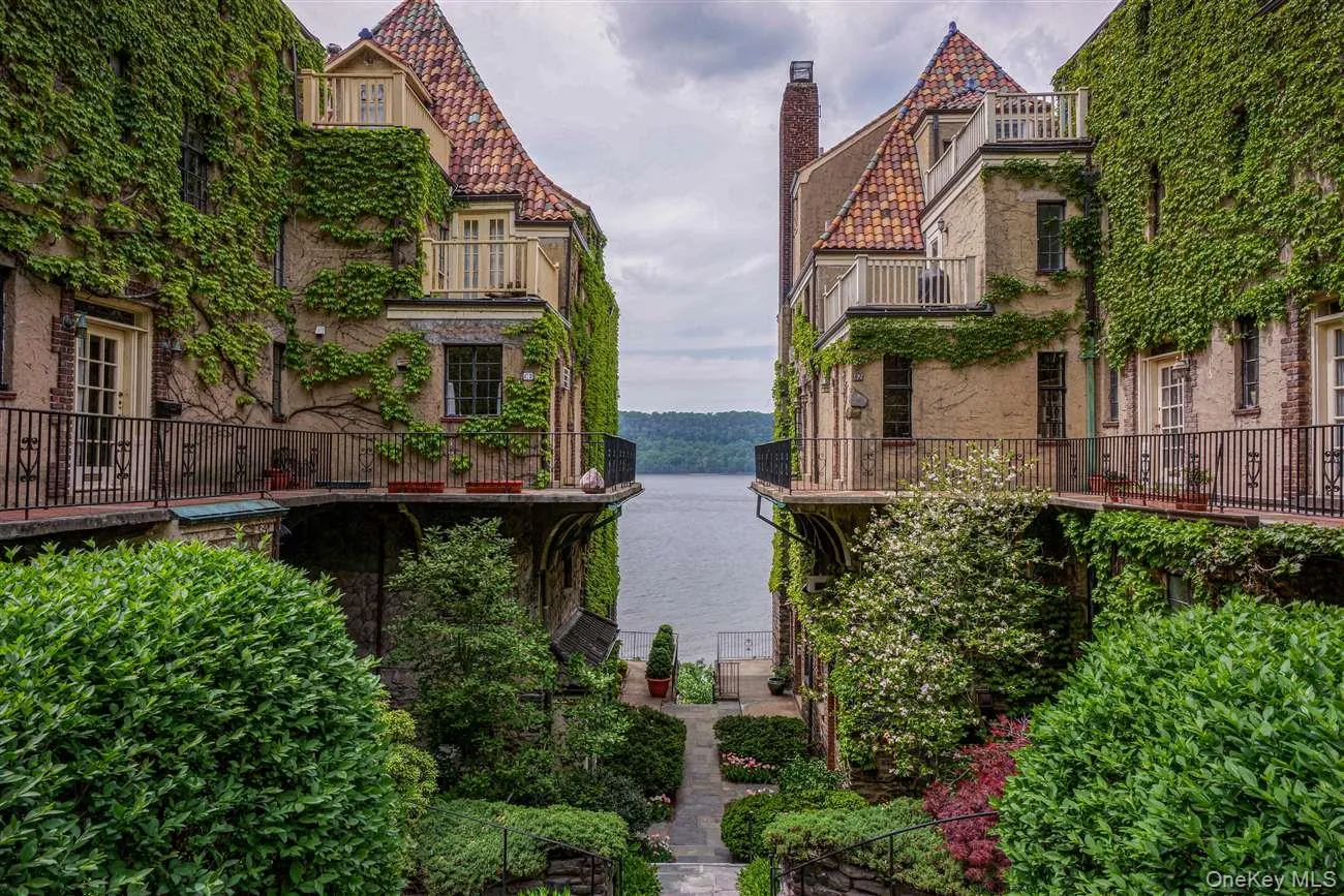 View of community with a water view and a balcony View of community with a water view and a balcony