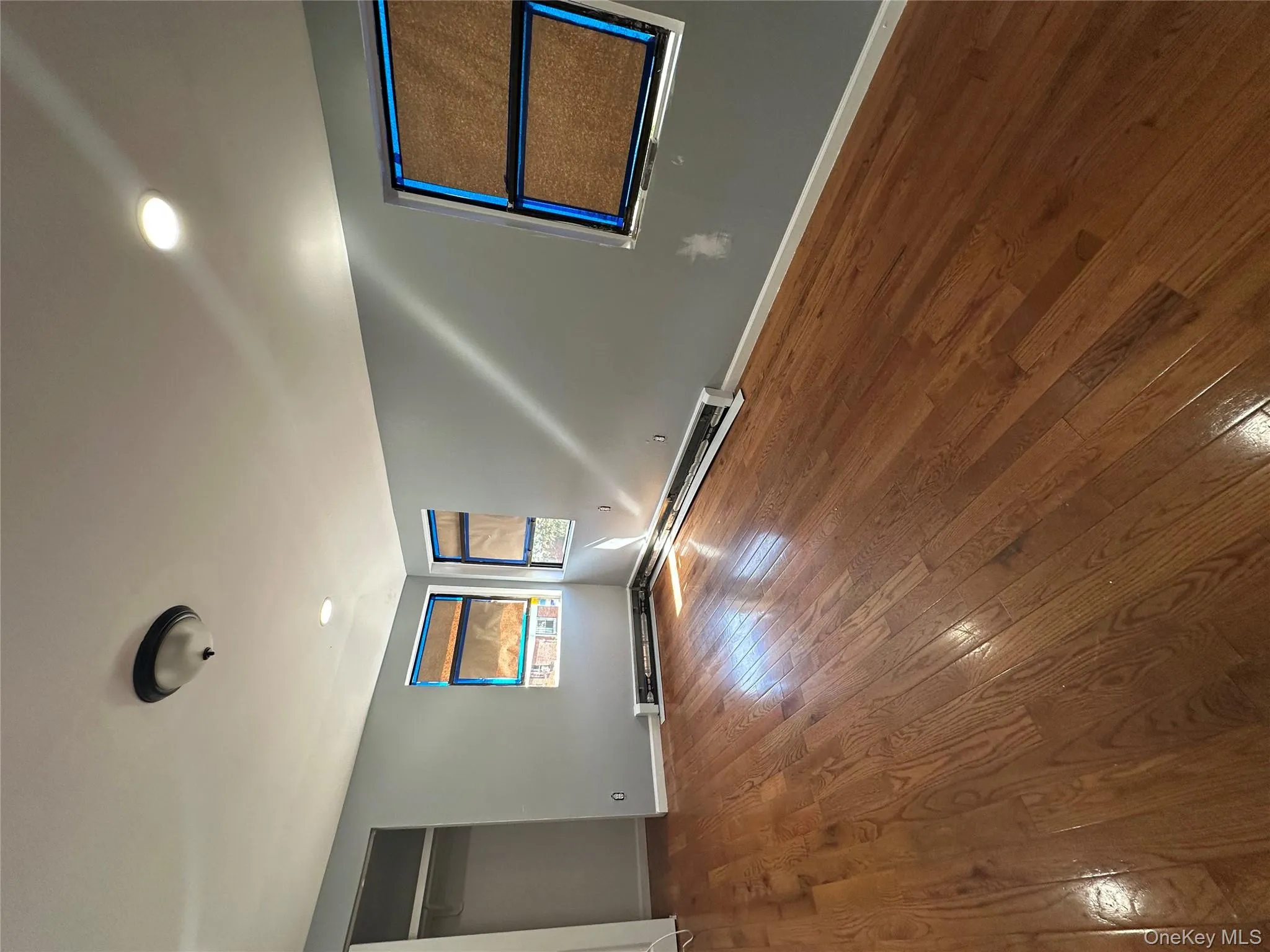 Unfurnished bedroom with hardwood / wood-style floors, a closet, and recessed lighting Unfurnished bedroom with hardwood / wood-style floors, a closet, and recessed lighting