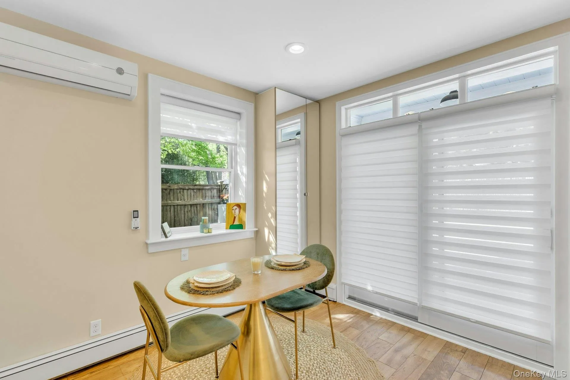 Dining room featuring the entryway slider with full blinds for privacy. Dining room featuring the entryway slider with full blinds for privacy.