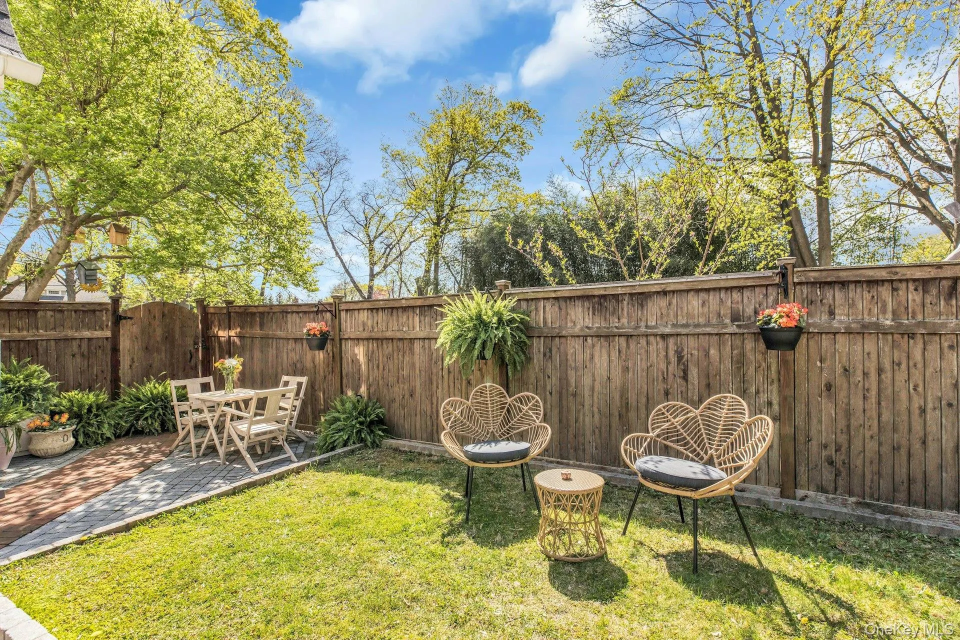 View of yard featuring a patio and a gate View of yard featuring a patio and a gate