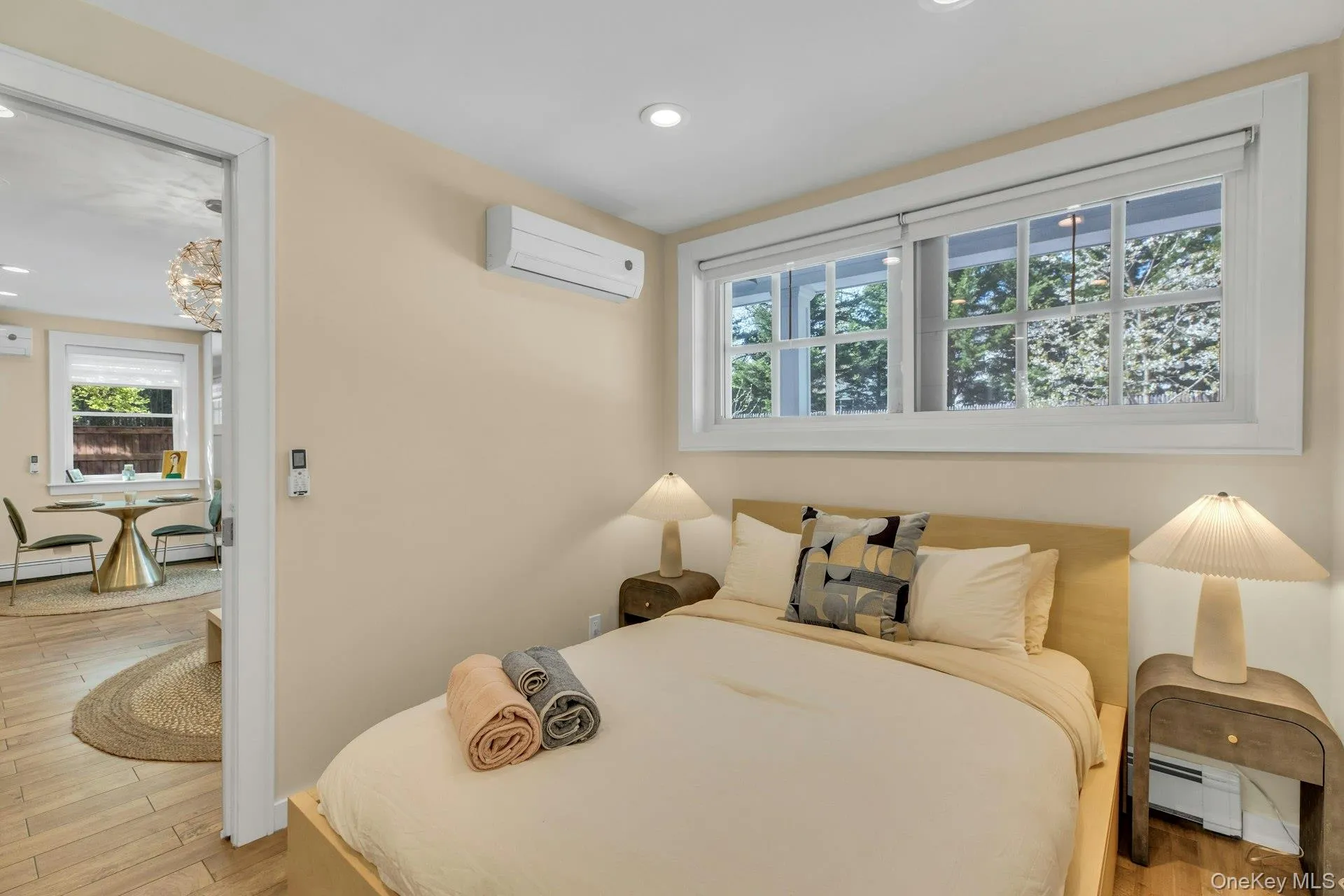 Bedroom with multiple windows, baseboard heating, recessed lighting Bedroom with multiple windows, baseboard heating, recessed lighting