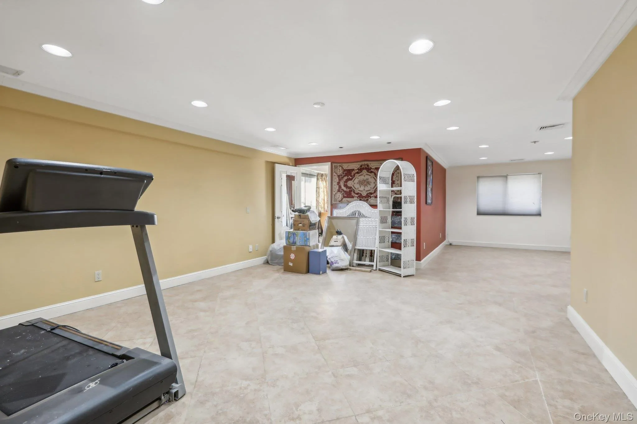 Workout room with recessed lighting and light tile patterned floors Workout room with recessed lighting and light tile patterned floors