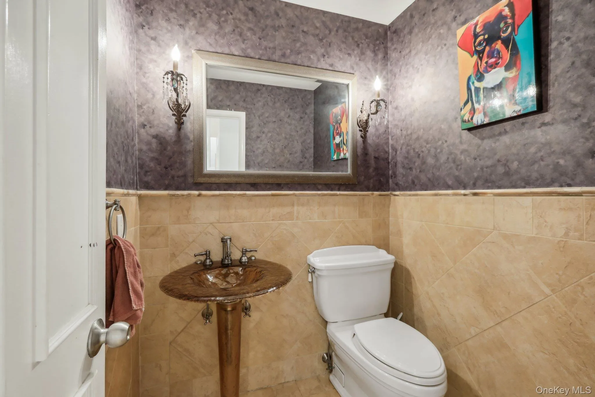 Bathroom featuring wainscoting and tile walls Bathroom featuring wainscoting and tile walls