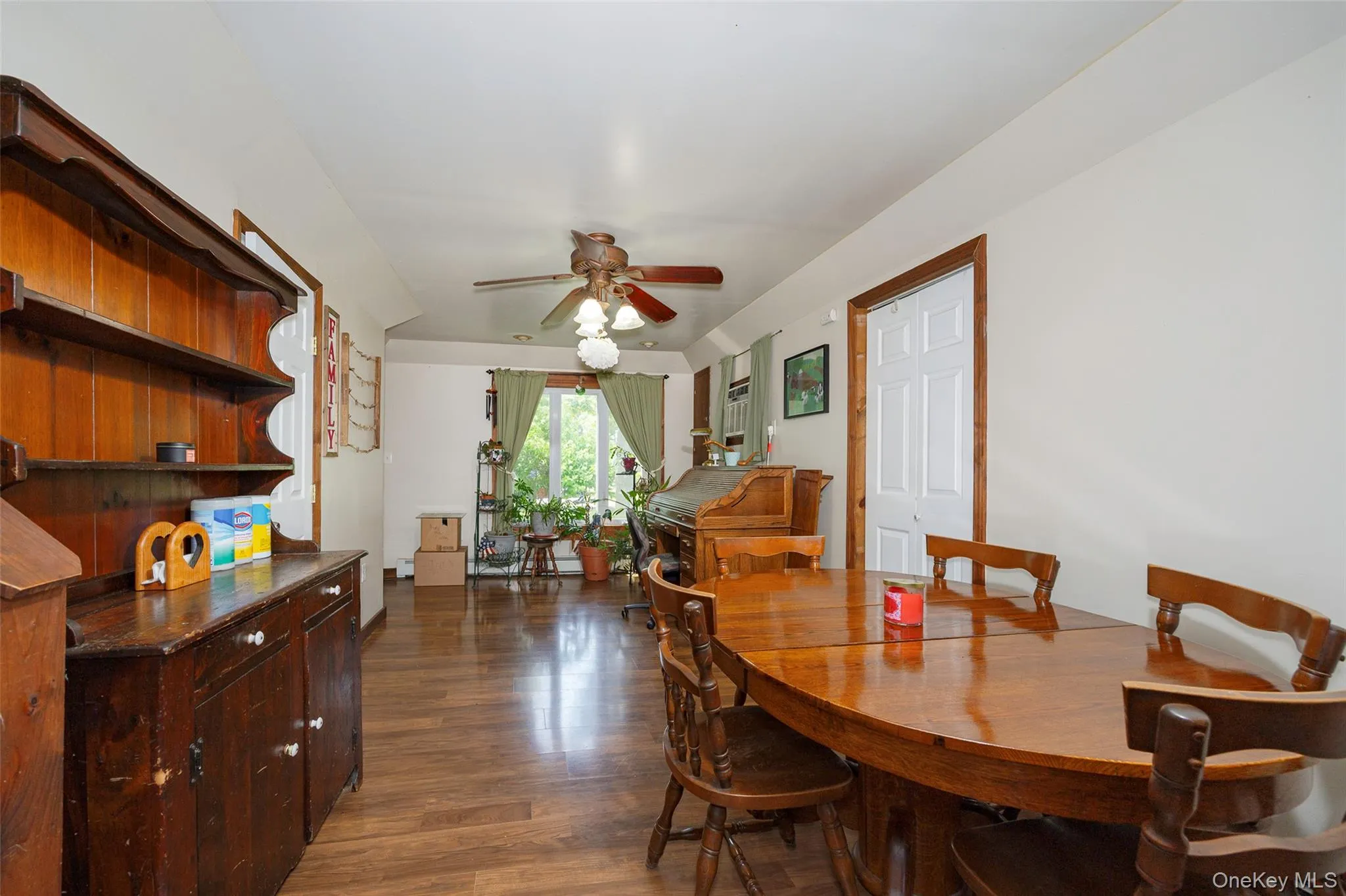 Dining room featuring wood finished floors and ceiling fan Dining room featuring wood finished floors and ceiling fan