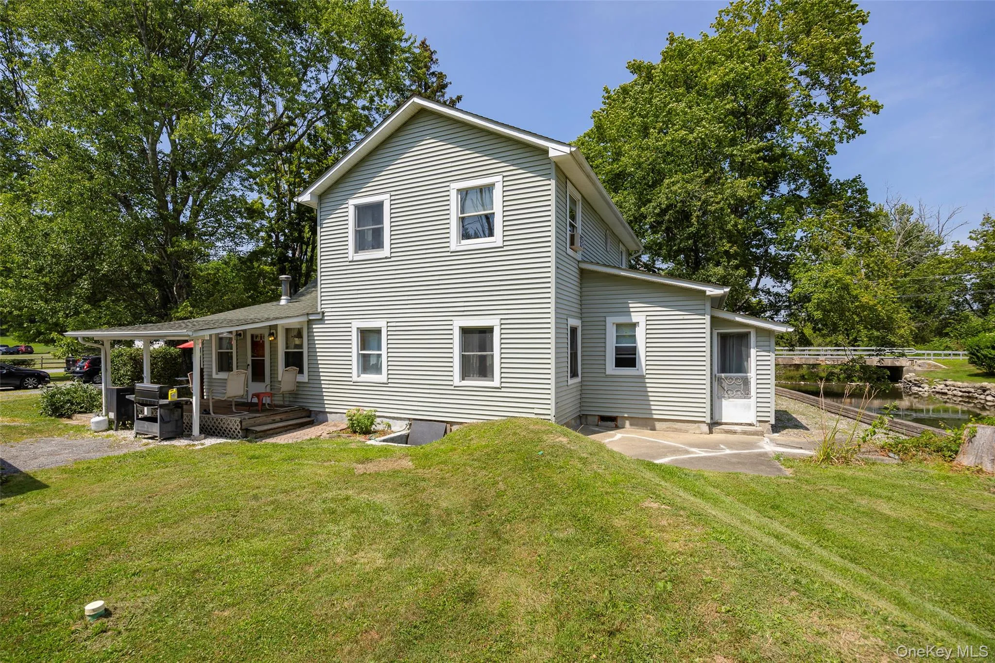 Back of house featuring a patio and a yard Back of house featuring a patio and a yard