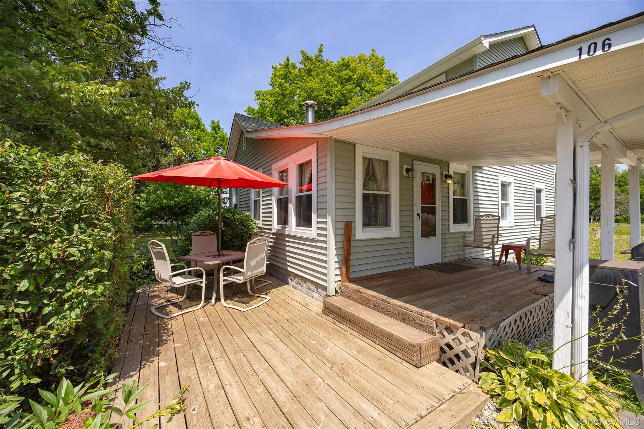Wooden deck with outdoor dining area Wooden deck with outdoor dining area