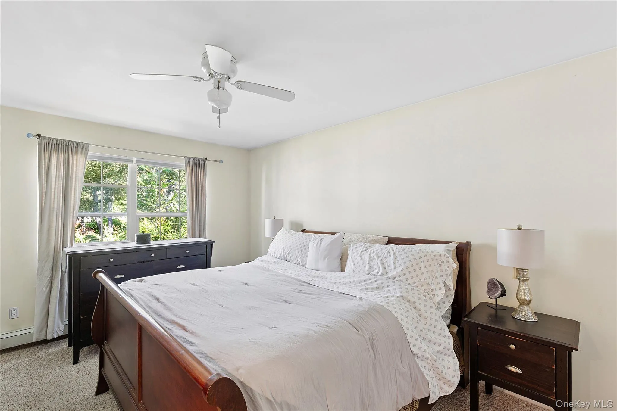 Bedroom with light carpet and ceiling fan Bedroom with light carpet and ceiling fan