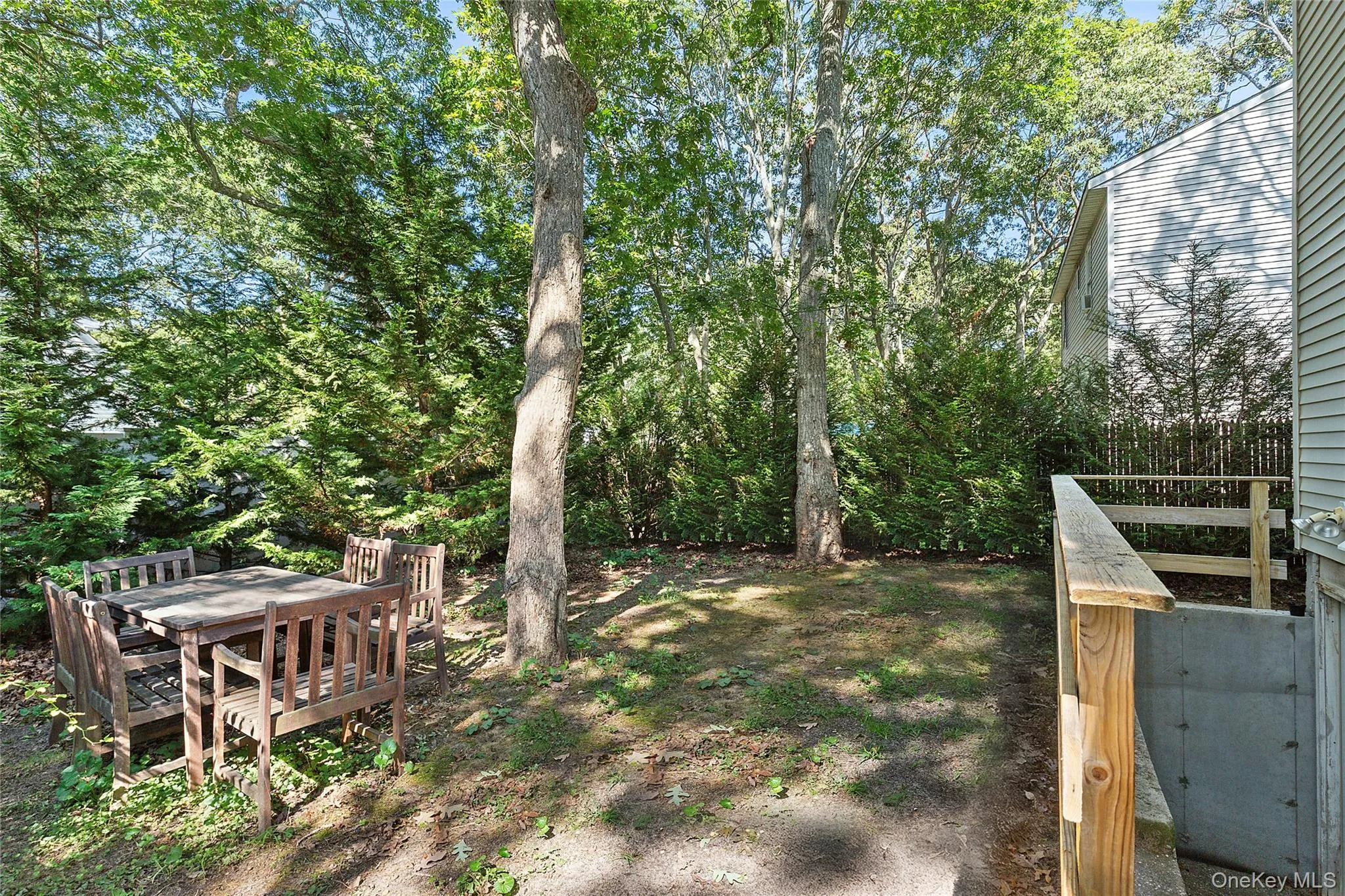 View of yard featuring a wooden deck View of yard featuring a wooden deck