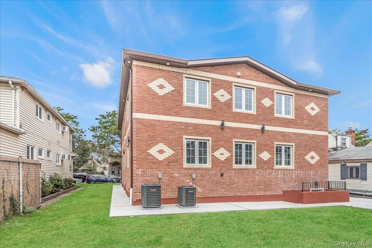 Back of house with brick siding and a patio Back of house with brick siding and a patio
