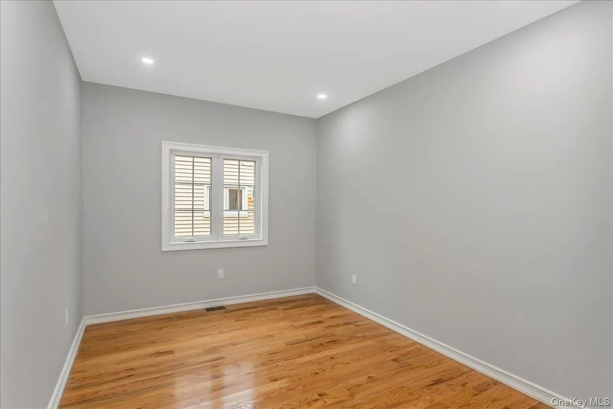 Empty room featuring light wood-style floors and recessed lighting Empty room featuring light wood-style floors and recessed lighting