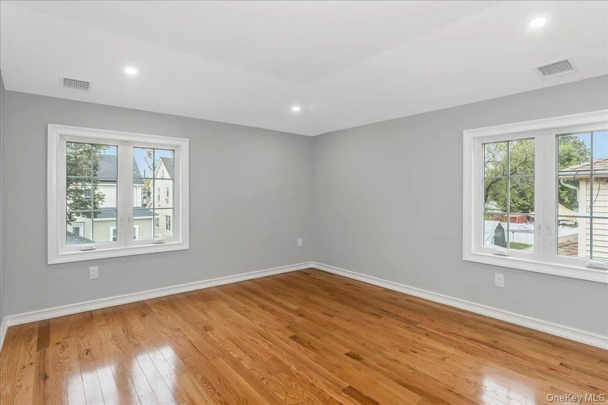 Empty room featuring recessed lighting and light wood finished floors Empty room featuring recessed lighting and light wood finished floors