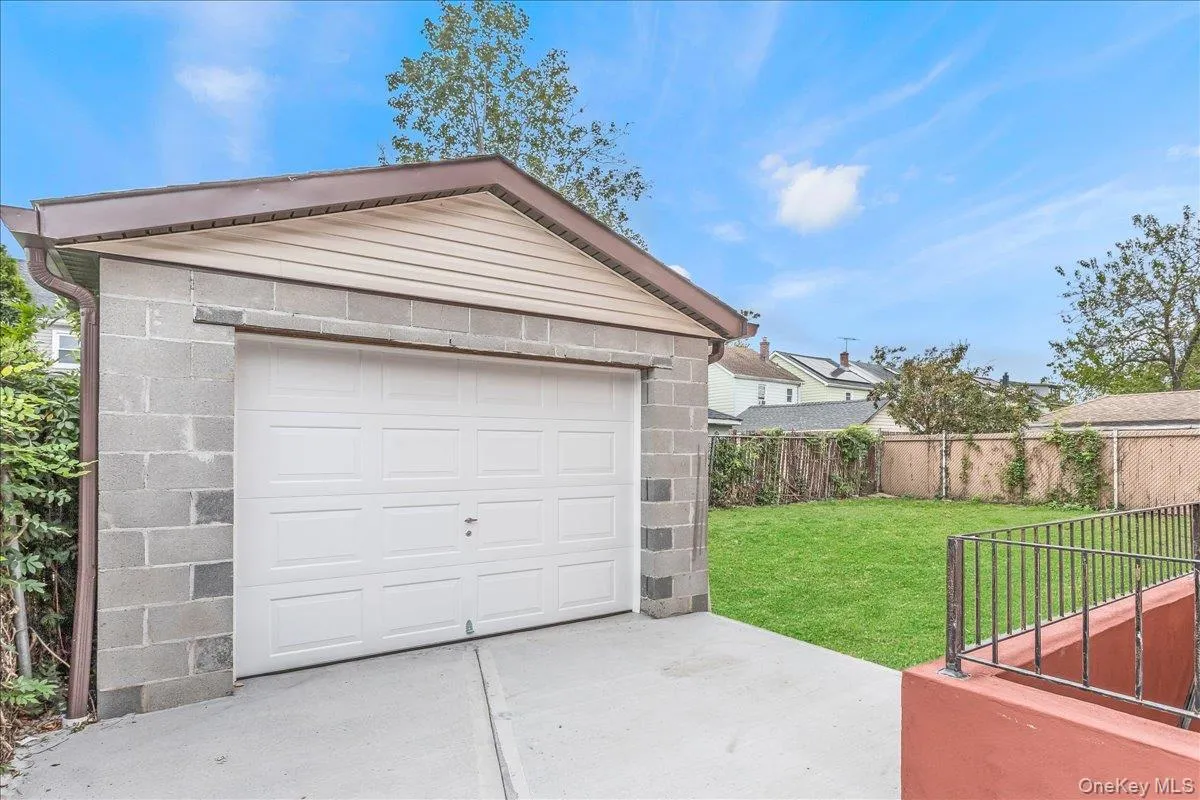Detached garage with concrete driveway Detached garage with concrete driveway