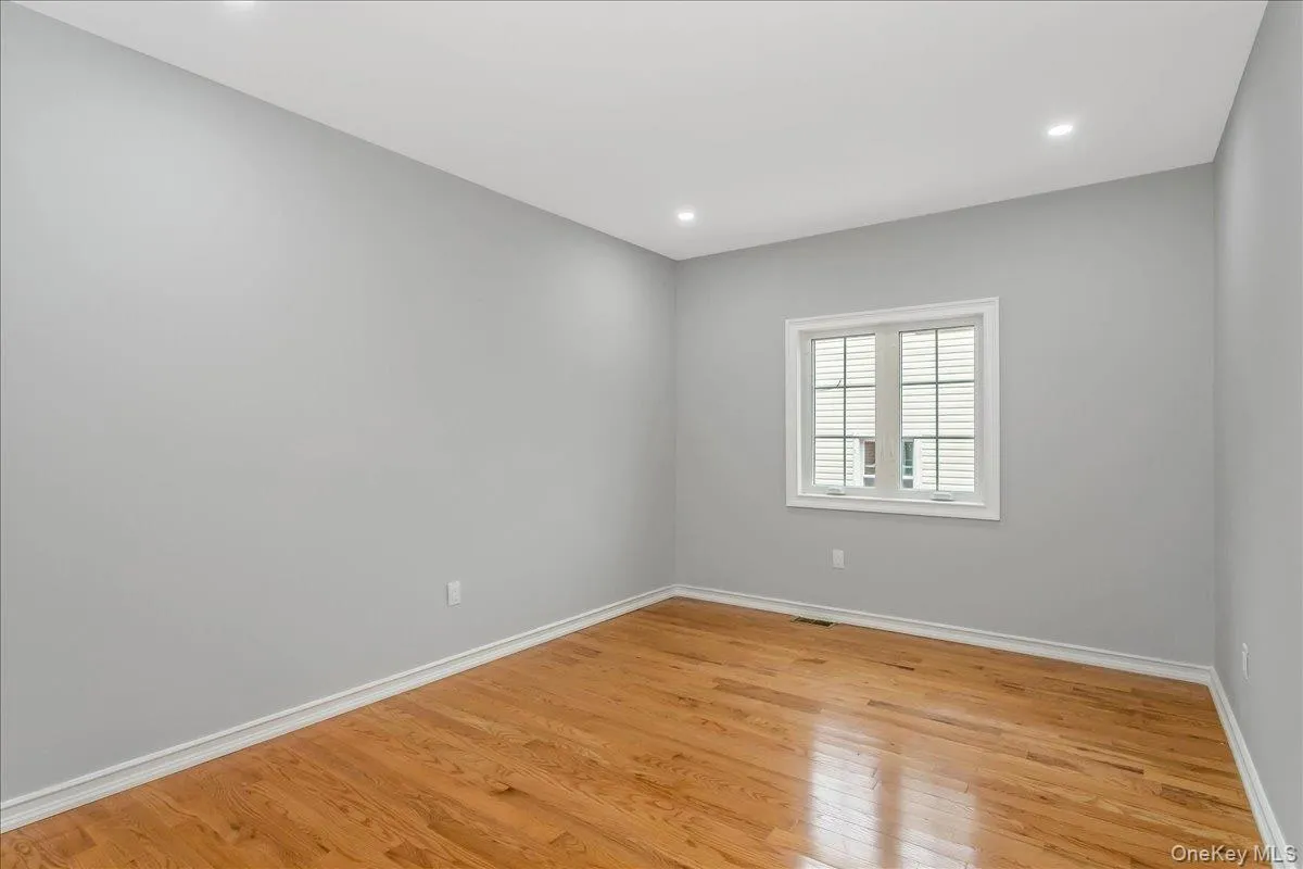 Spare room with light wood-style flooring and recessed lighting Spare room with light wood-style flooring and recessed lighting