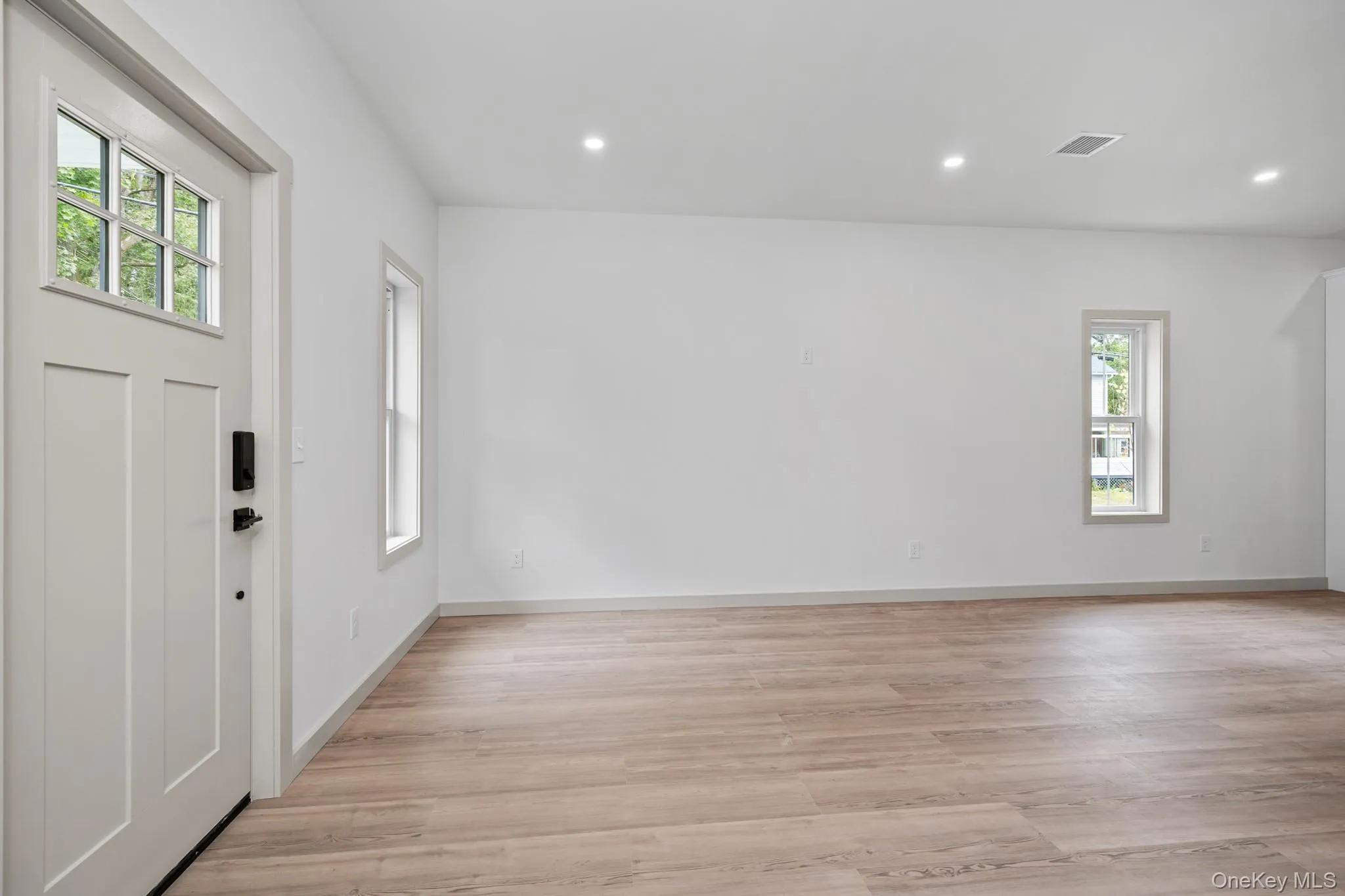 Foyer featuring light wood-style flooring and recessed lighting Foyer featuring light wood-style flooring and recessed lighting