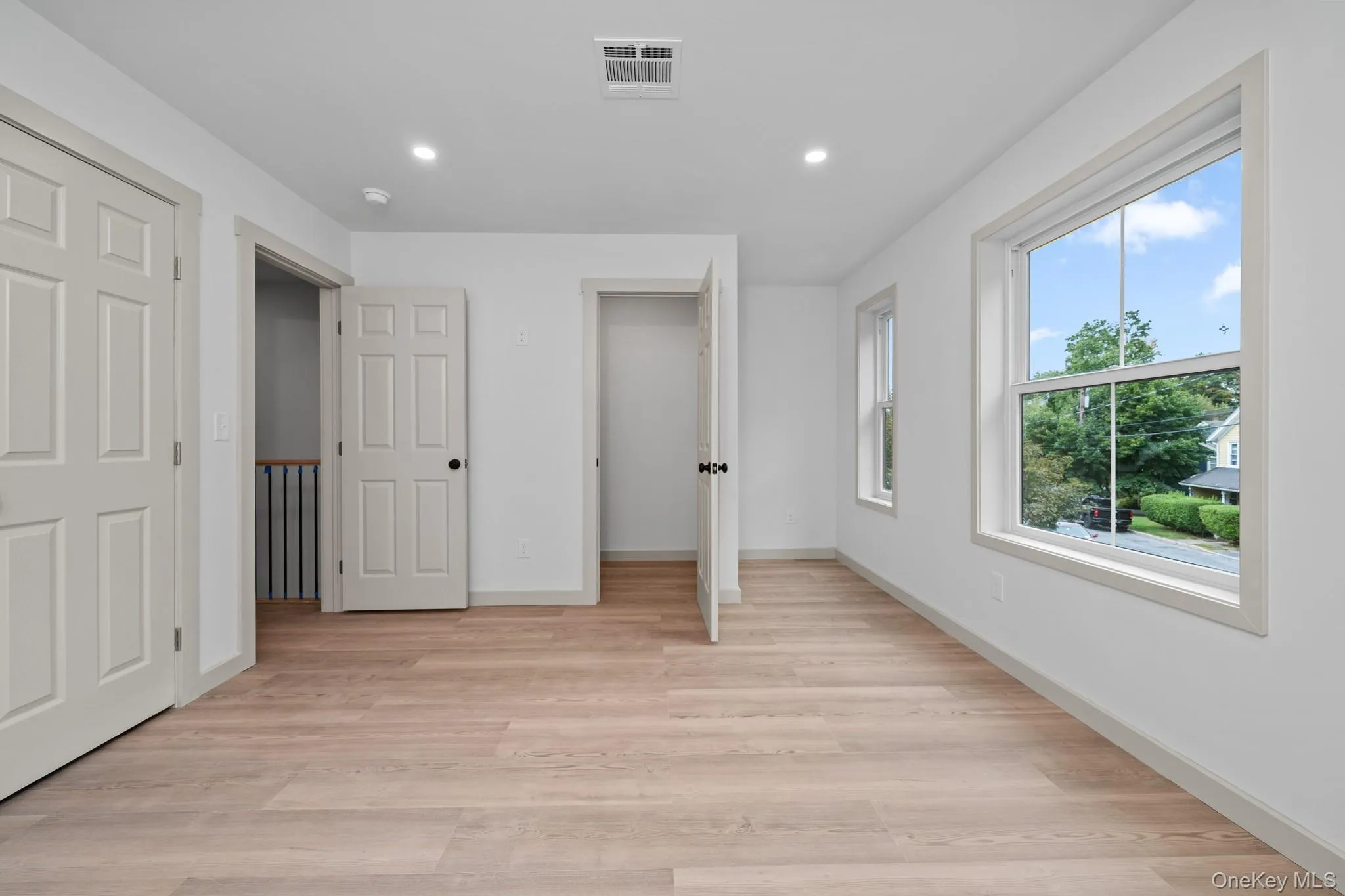 Unfurnished bedroom with recessed lighting and light wood-style flooring Unfurnished bedroom with recessed lighting and light wood-style flooring