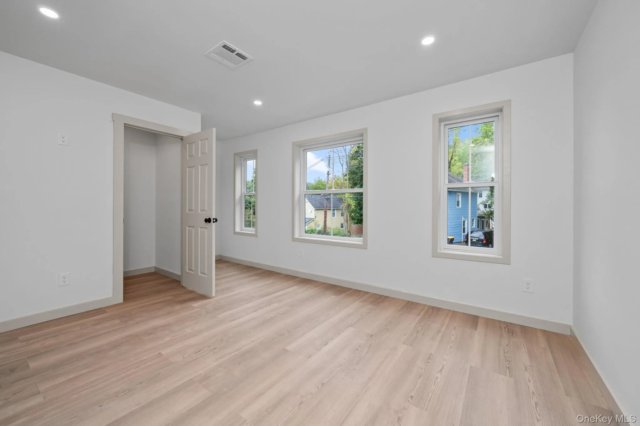 Unfurnished bedroom featuring light wood finished floors and recessed lighting Unfurnished bedroom featuring light wood finished floors and recessed lighting