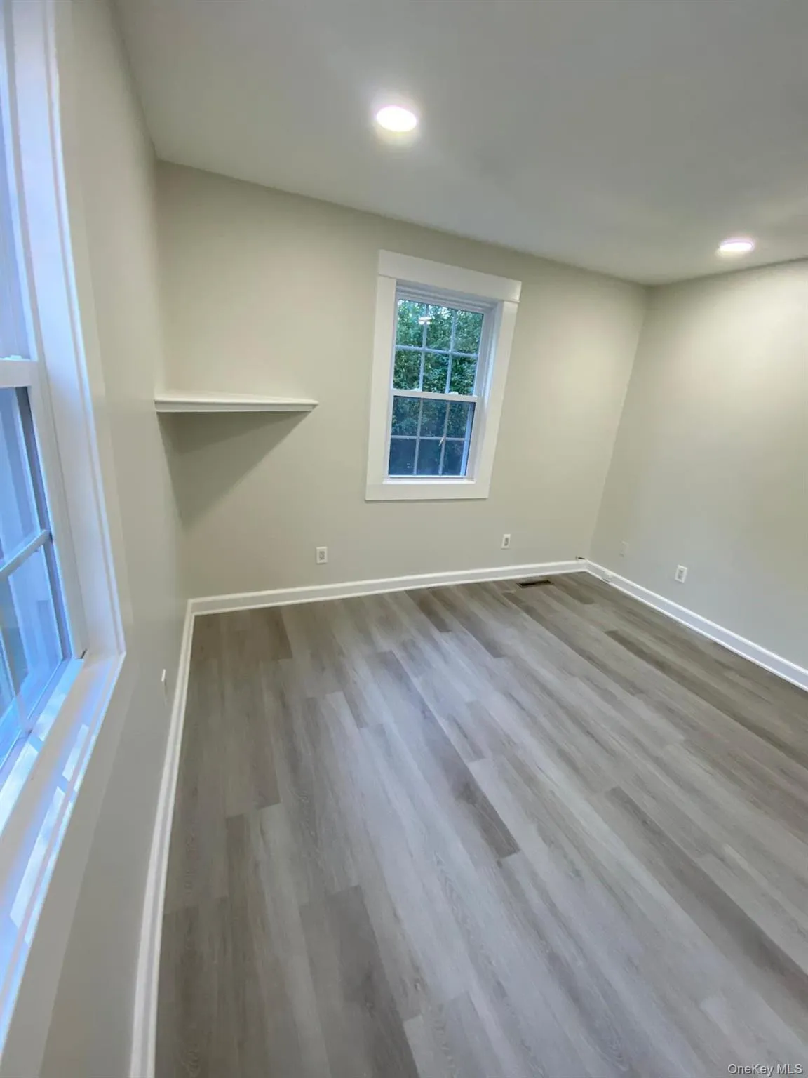 Spare room featuring light wood finished floors and recessed lighting Spare room featuring light wood finished floors and recessed lighting