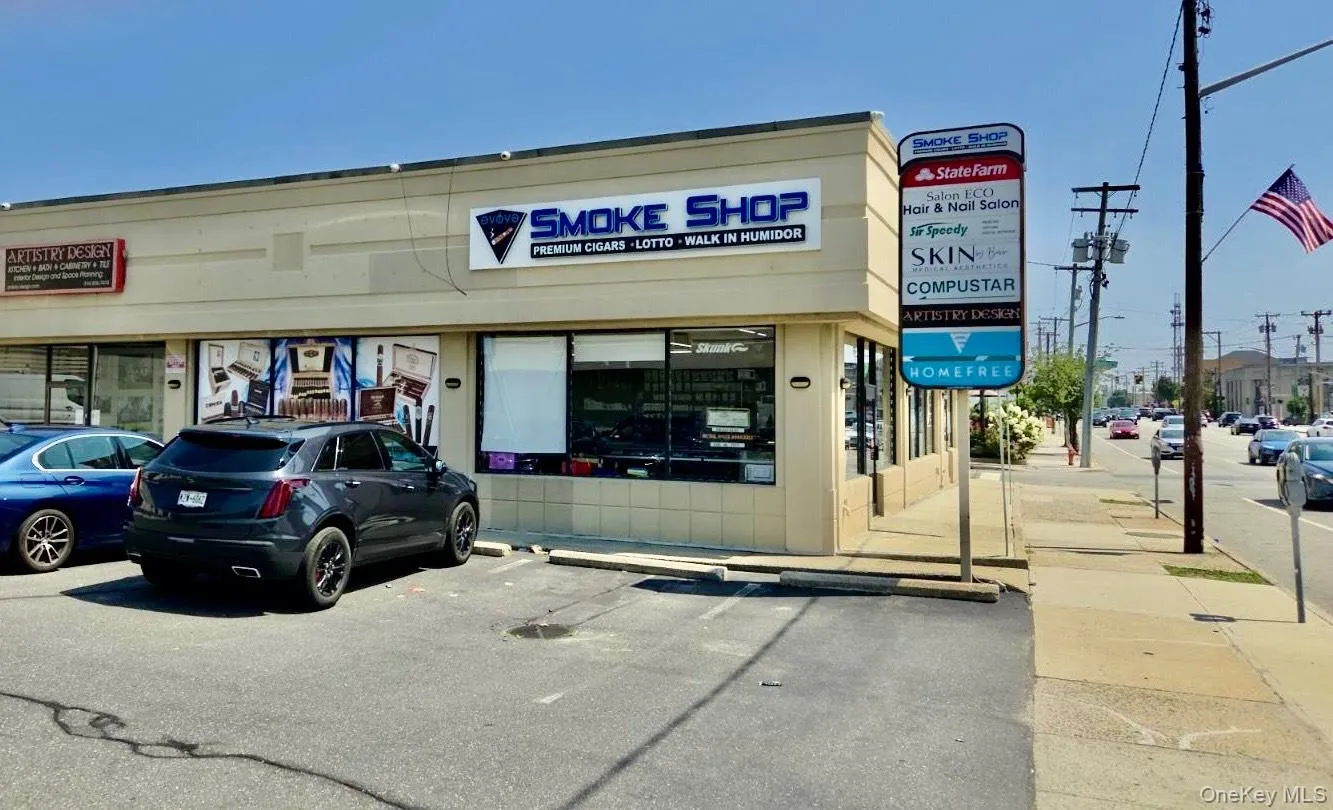 View of commercial property featuring uncovered parking View of commercial property featuring uncovered parking