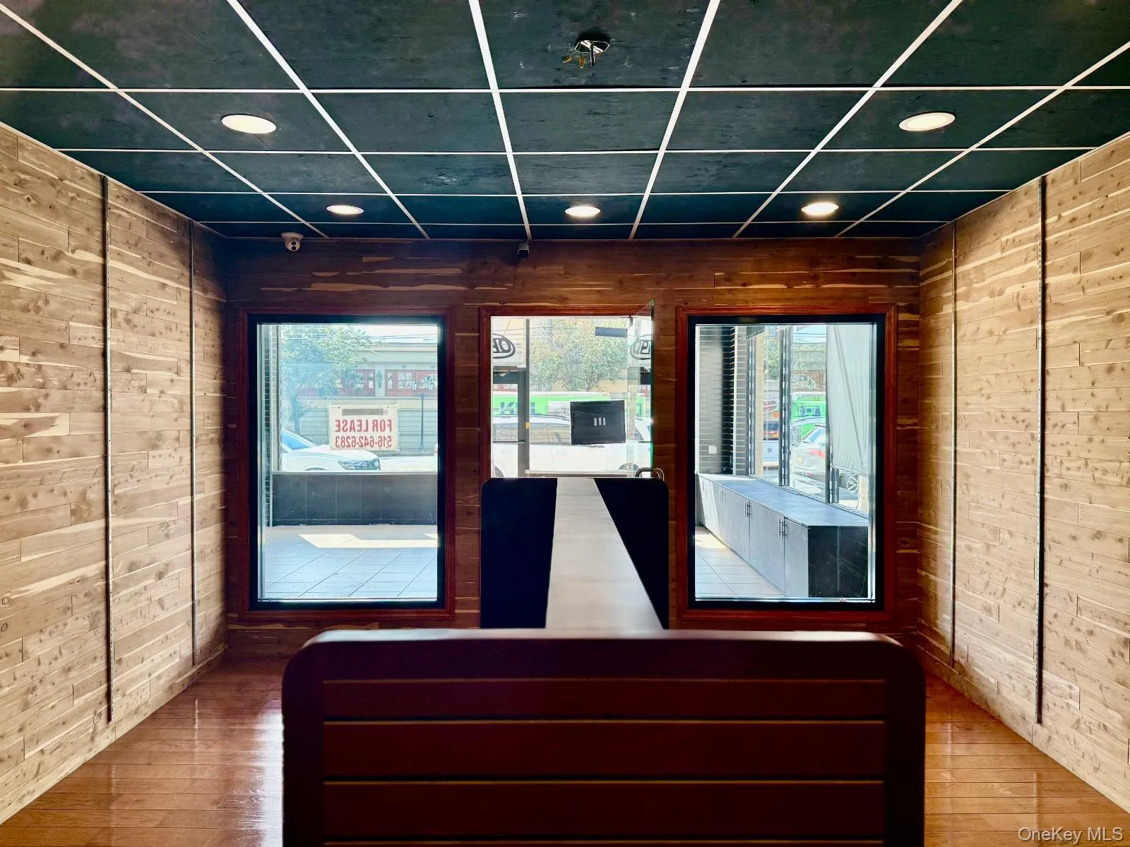 Reception area with wood walls and recessed lighting Reception area with wood walls and recessed lighting