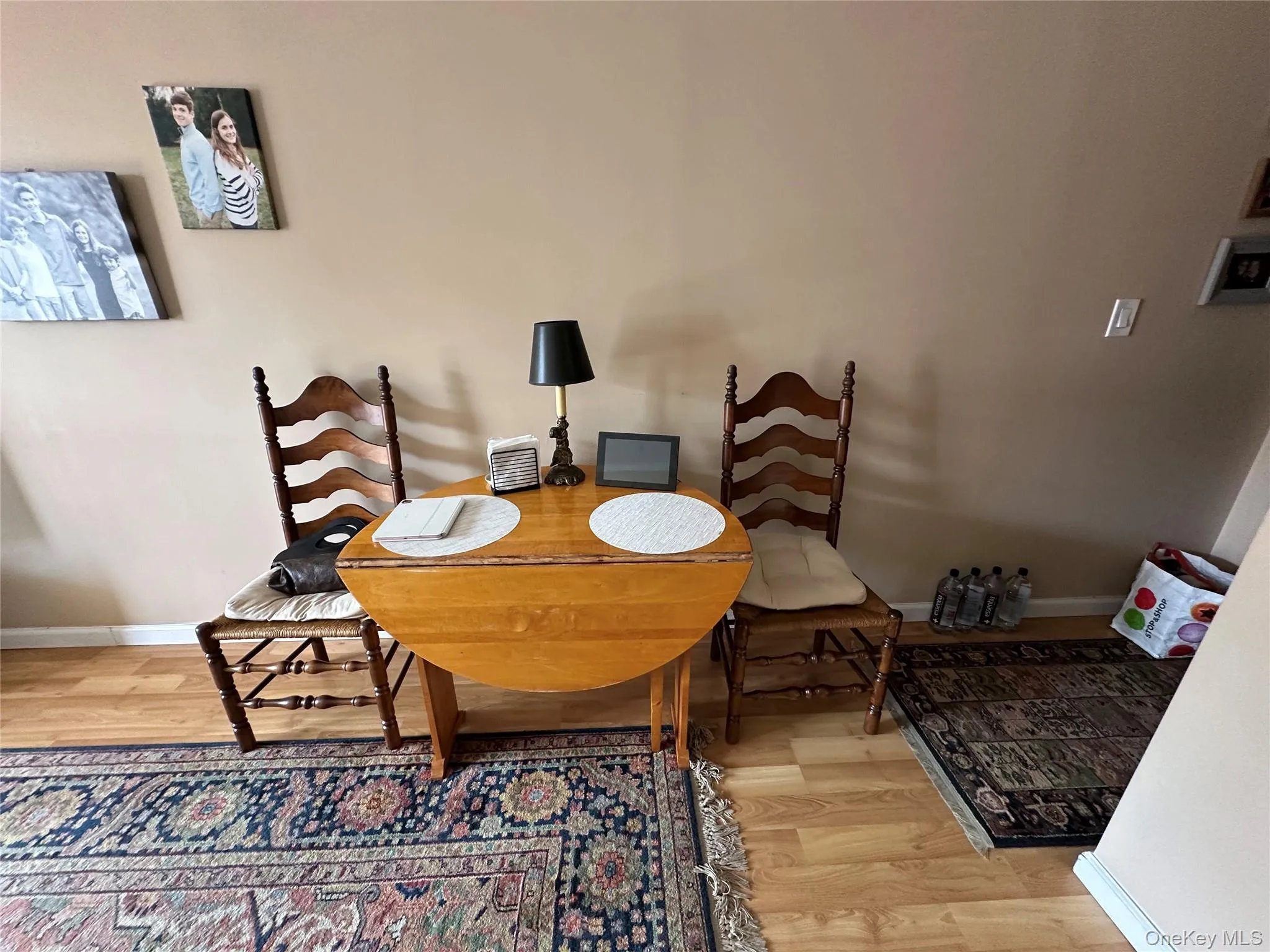 Dining area with light wood finished floors Dining area with light wood finished floors