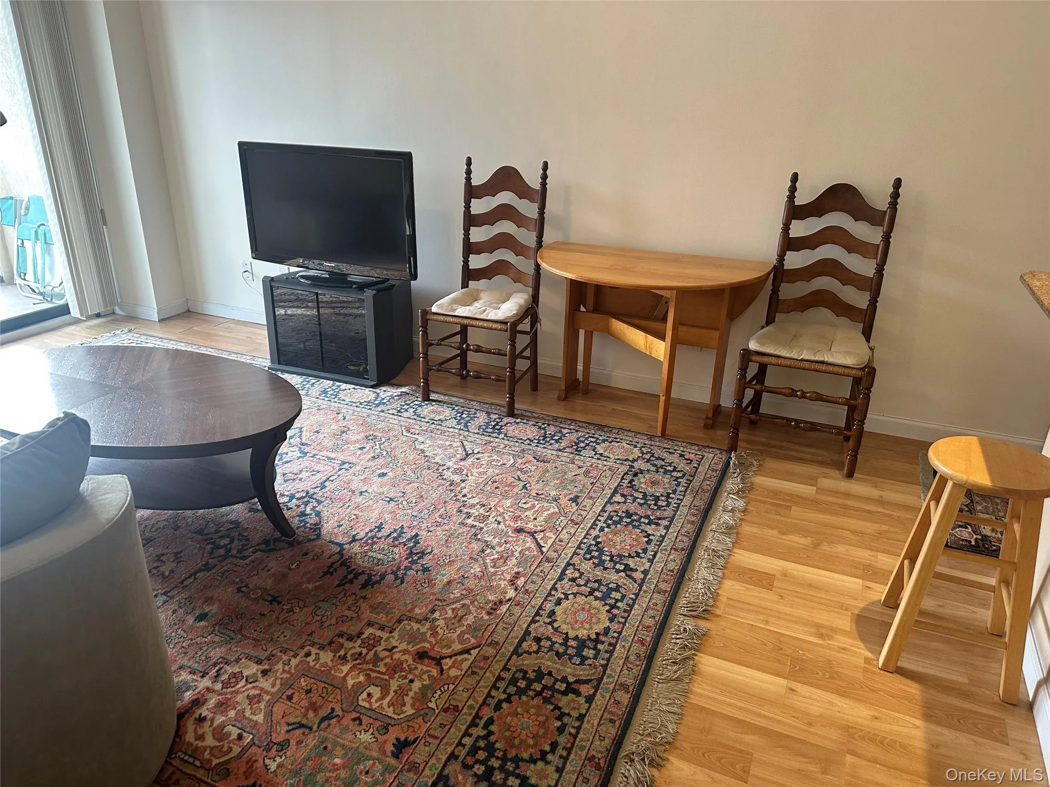 Living area with light wood-style flooring Living area with light wood-style flooring