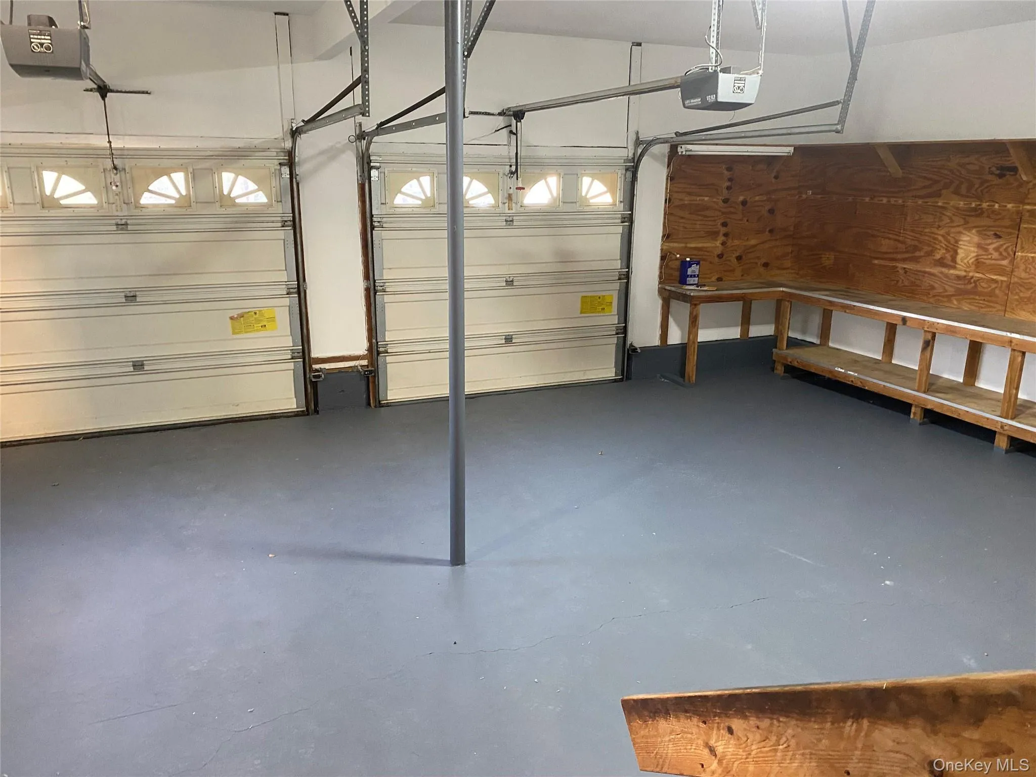 Oversized 2 1/2 Car Garage with work/storage area. Oversized 2 1/2 Car Garage with work/storage area.