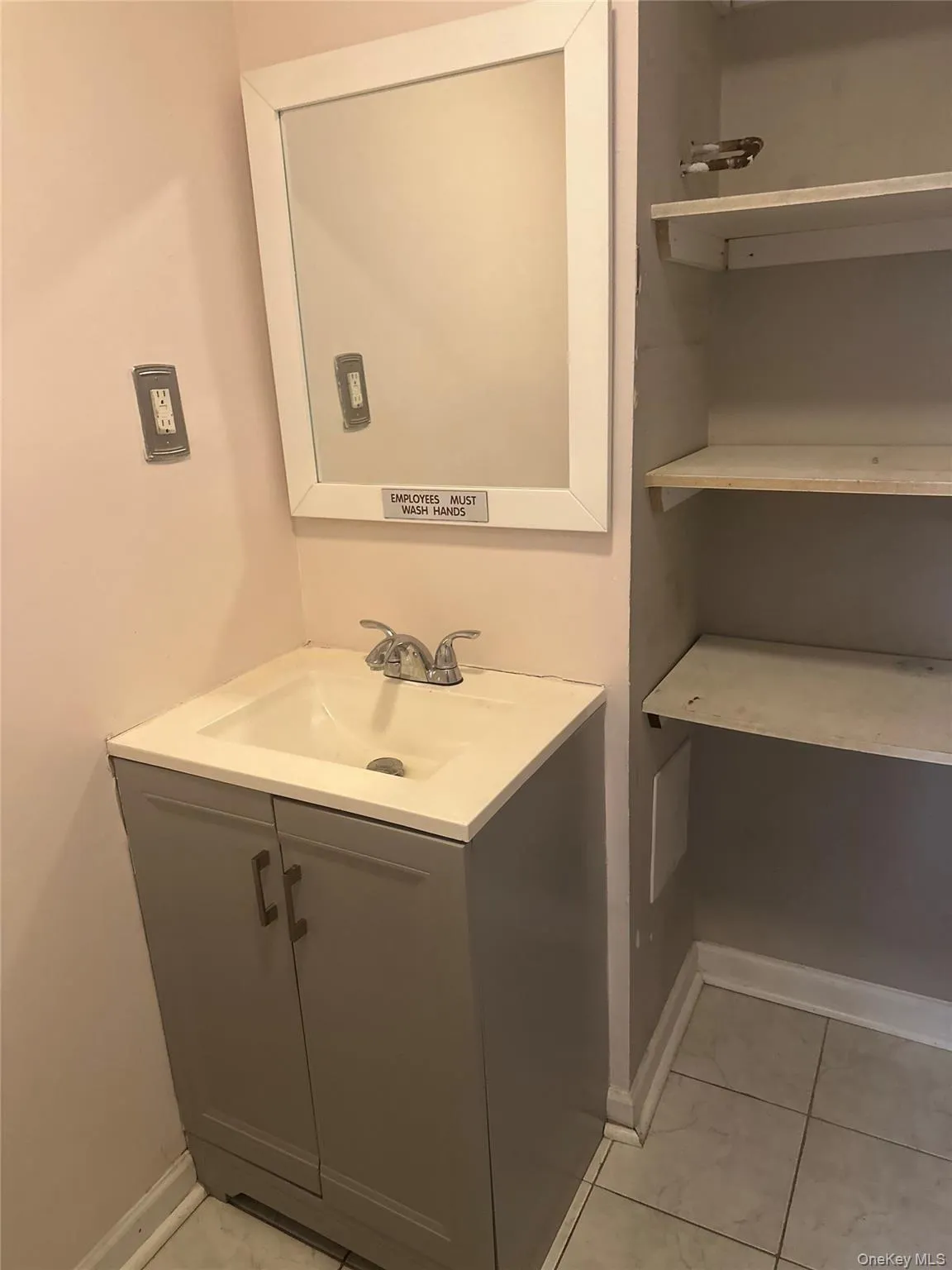 Bathroom with vanity and light tile patterned flooring Bathroom with vanity and light tile patterned flooring