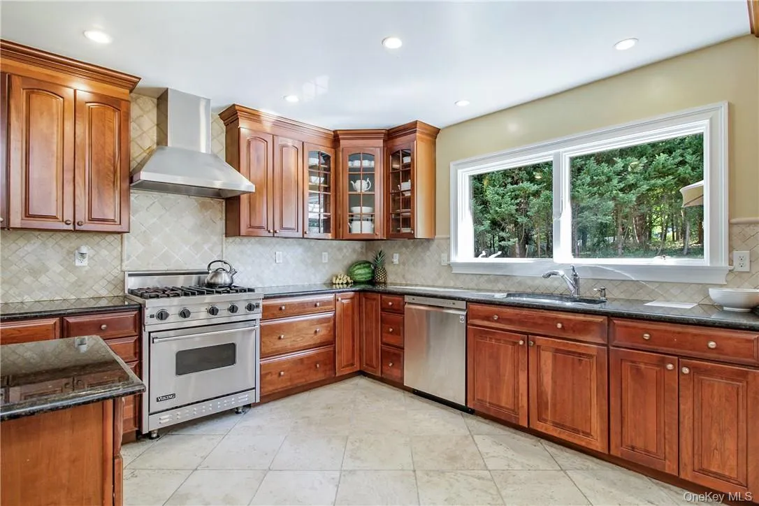eat-in-kitchen with stainless-steel appliances, granite counters, and ample cabinet storage eat-in-kitchen with stainless-steel appliances, granite counters, and ample cabinet storage
