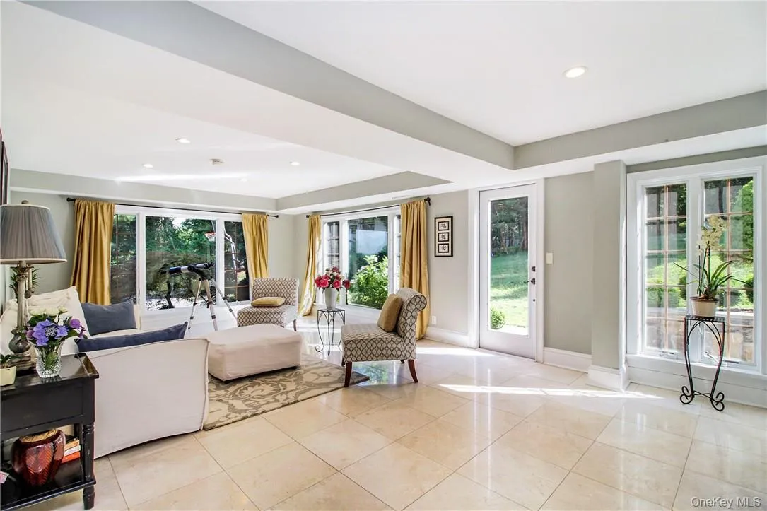 Sun filled family room with access to 2nd patio and bathroom Sun filled family room with access to 2nd patio and bathroom