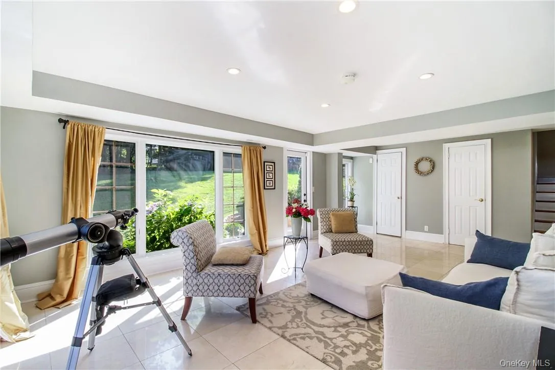 Sun filled family room with access to 2nd patio and bathroom Sun filled family room with access to 2nd patio and bathroom