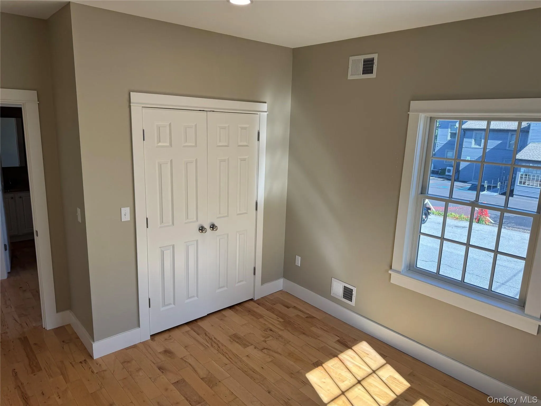 Unfurnished bedroom with light wood-type flooring, a closet, and recessed lighting Unfurnished bedroom with light wood-type flooring, a closet, and recessed lighting