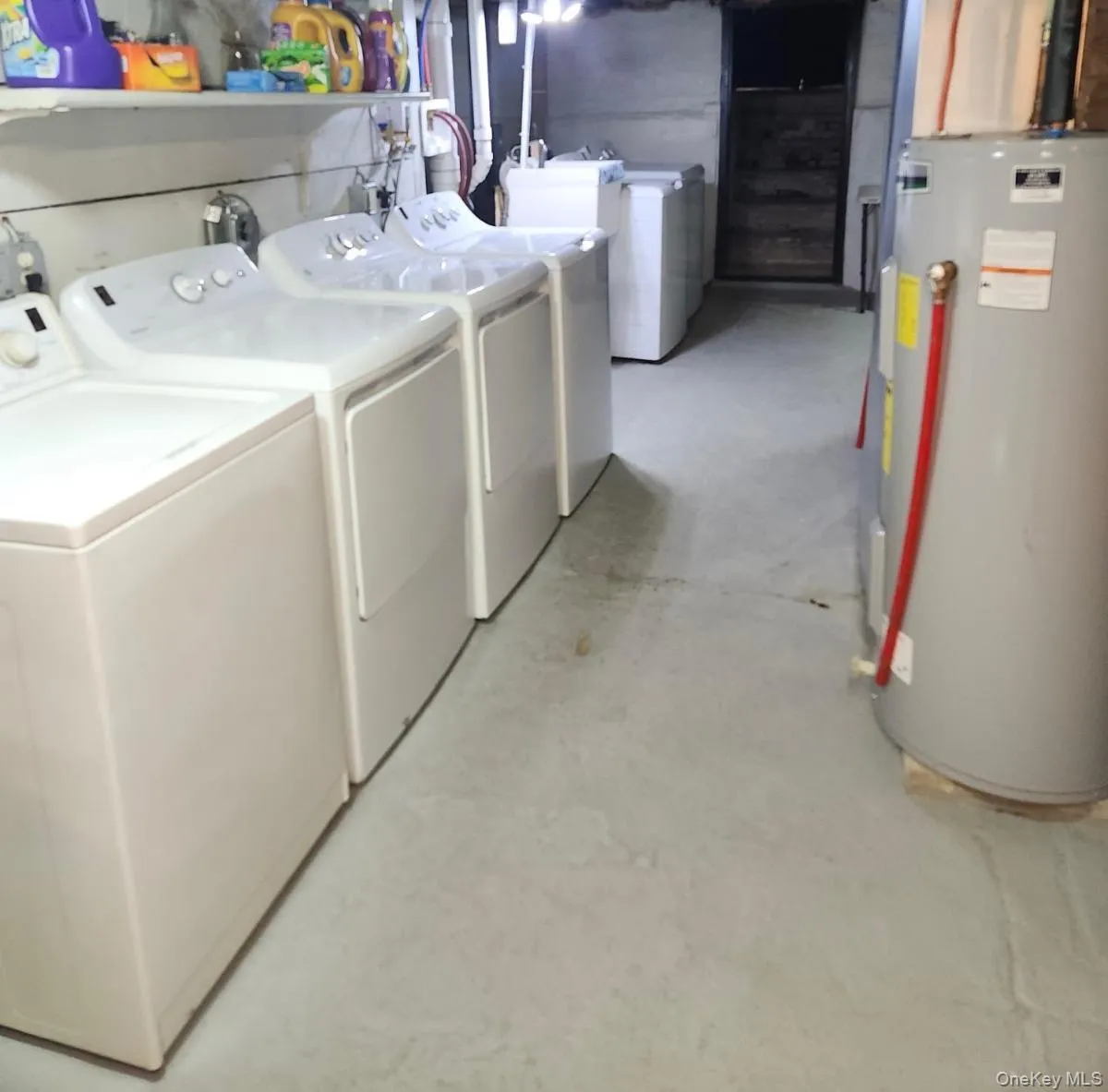 Basement laundry area with personal washing machine and dryer. Basement laundry area with personal washing machine and dryer.