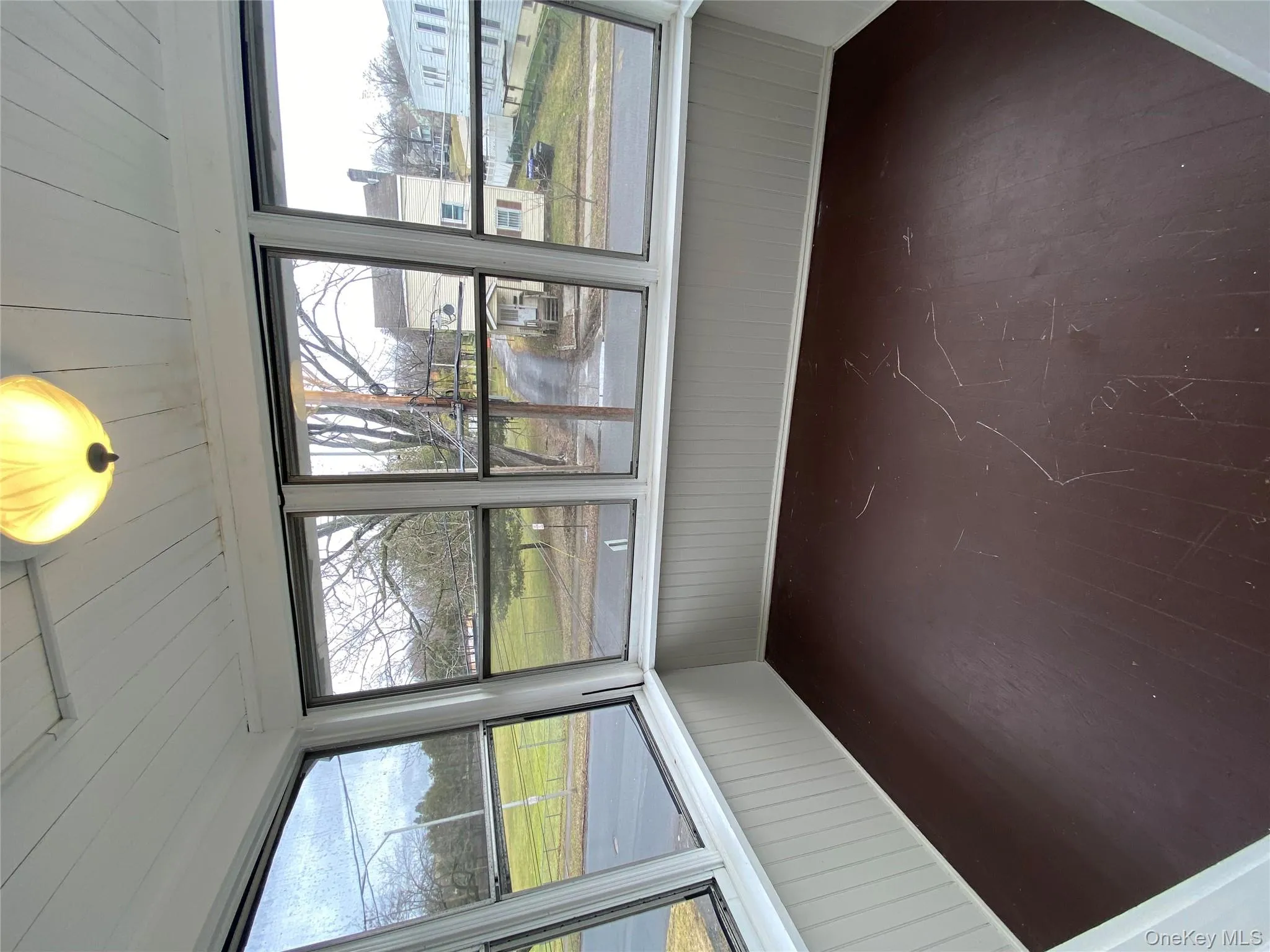 Unfurnished sunroom with hardwood / wood-style flooring Unfurnished sunroom with hardwood / wood-style flooring