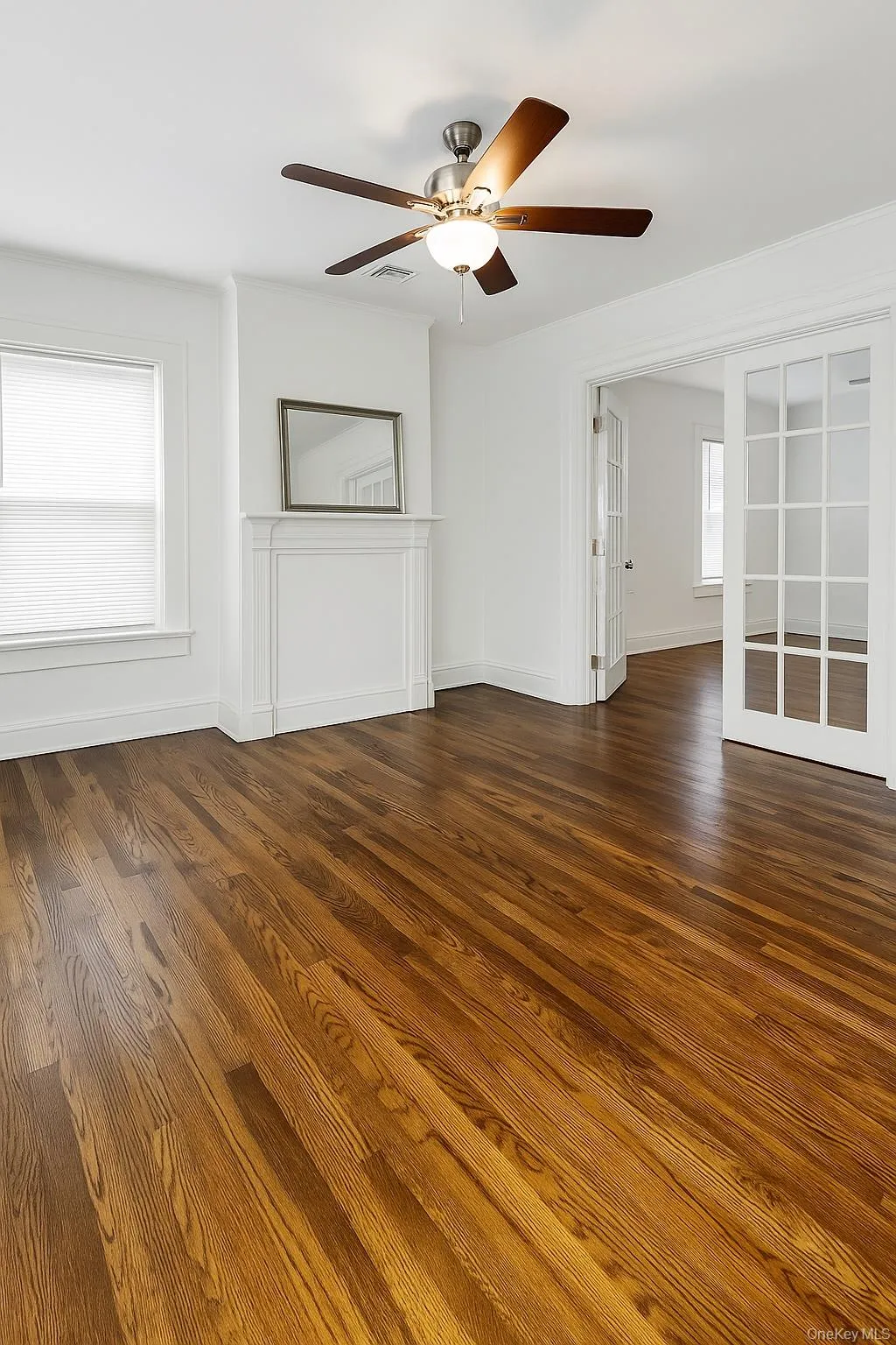 Spare room featuring  hardwood flooring and ceiling fan Spare room featuring  hardwood flooring and ceiling fan