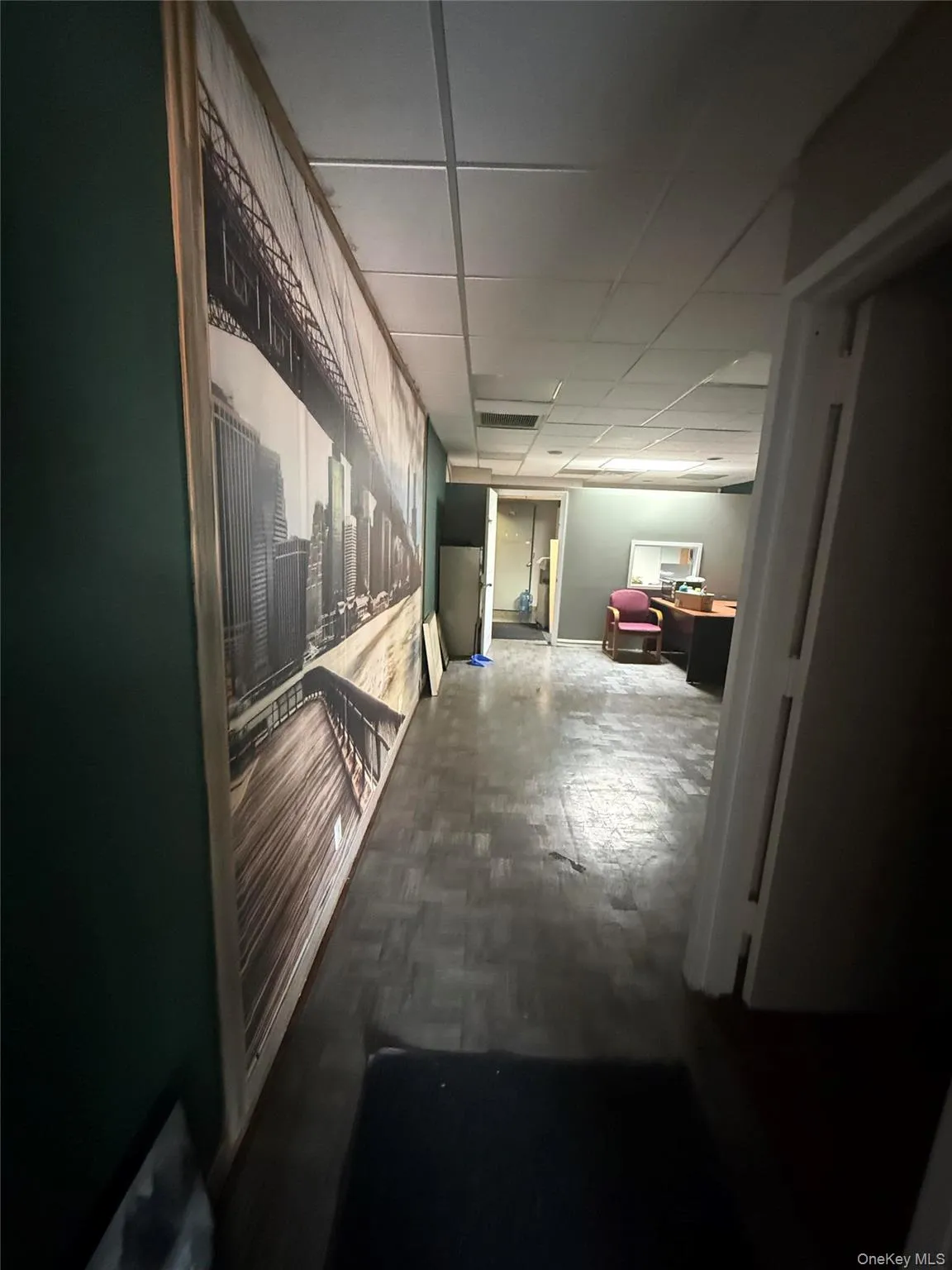 Hallway with a paneled ceiling Hallway with a paneled ceiling