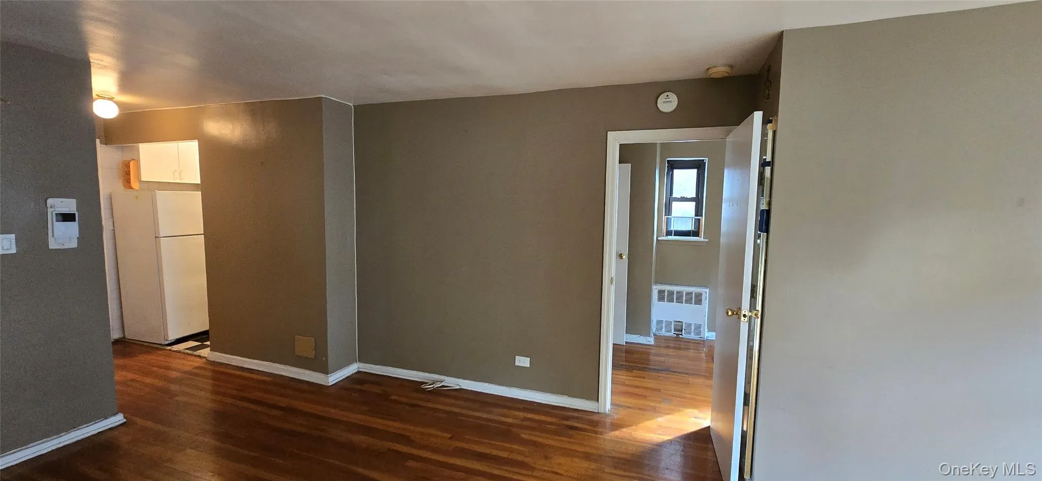 Empty room with dark wood-style flooring Empty room with dark wood-style flooring