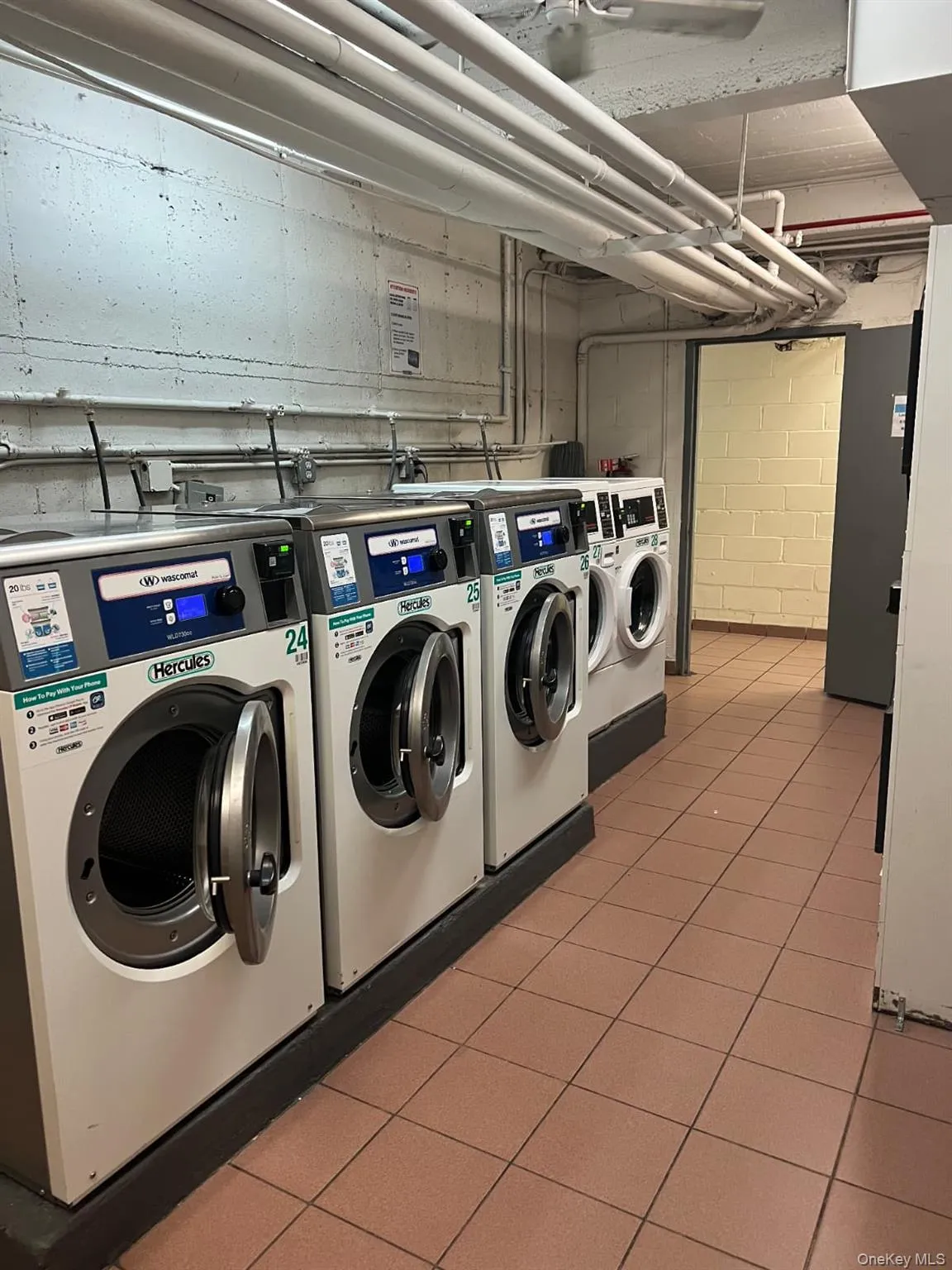Community laundry room with washer and dryer Community laundry room with washer and dryer