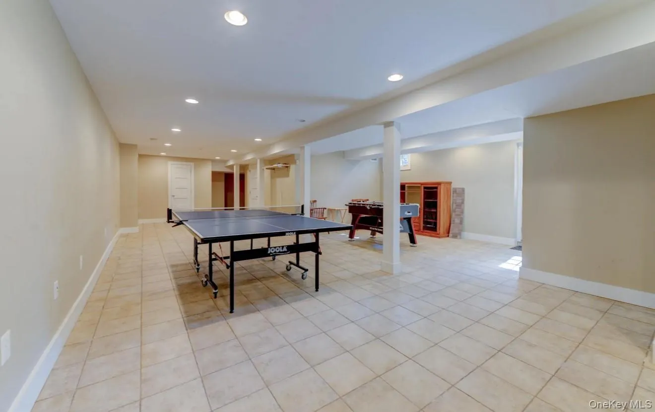 Game room featuring recessed lighting and light tile patterned flooring Game room featuring recessed lighting and light tile patterned flooring
